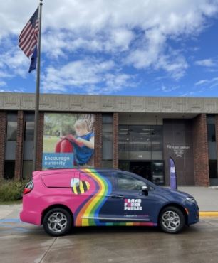 Van in front of library